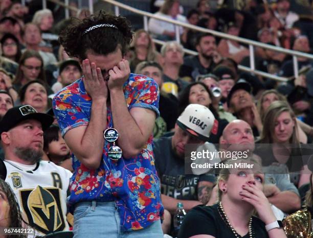 Vegas Golden Knights fans react after a first-period goal by Devante Smith-Pelly of the Washington Capitals against the Golden Knights during a...