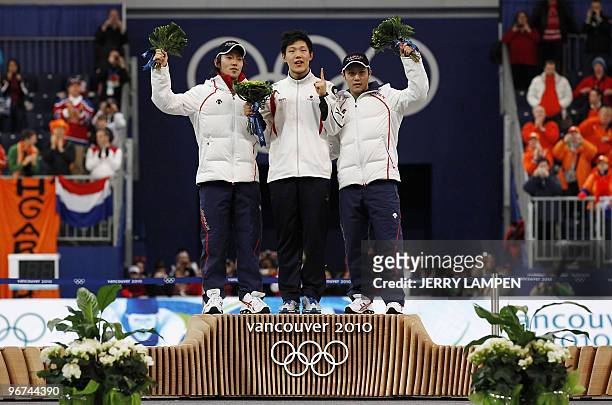 Gold medal winner South Korea's Mo Tae-Bum , silver Medalist Japan's Keiichiro Nagashima and bronze medal winner Japan's Joji Kato celebrate victory...