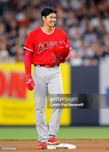 May 25: Rookie Pitcher Shohei Ohtani of the Los Angeles Angels smiling after running to second base in an MLB baseball game against the New York...