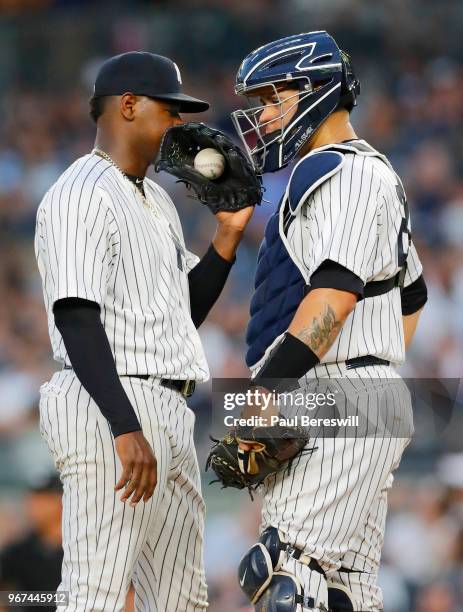 Pitcher Luis Severino talks with catcher Gary Sanchez of the New York Yankees pitches in an MLB baseball game against the Los Angeles Angels on May...