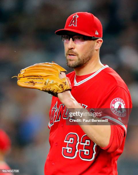 Pitcher Jim Johnson of the Los Angeles Angels looks over in an MLB baseball game against the New York Yankees on May 25, 2018 at Yankee Stadium in...