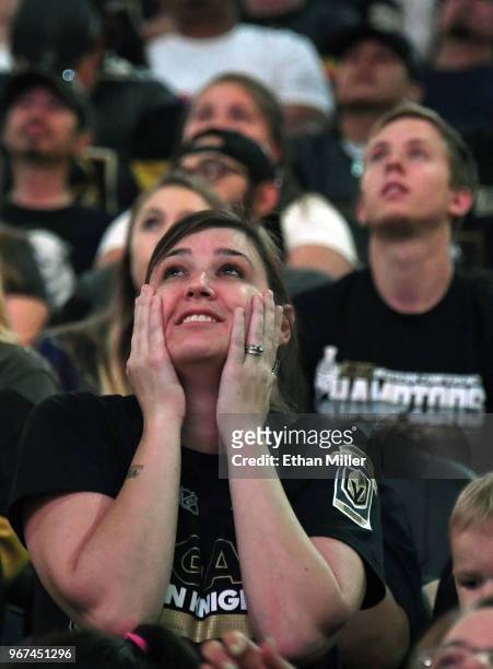 Vegas Golden Knights fans react after a first-period goal by T.J. Oshie of the Washington Capitals against the Golden Knights during a Golden Knights...