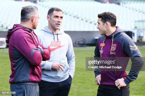 Maroons legend Cameron Smith and Billy Slater, out with a hamstring injury, talk together during a Queensland Maroons Captain's Run at the Melbourne...