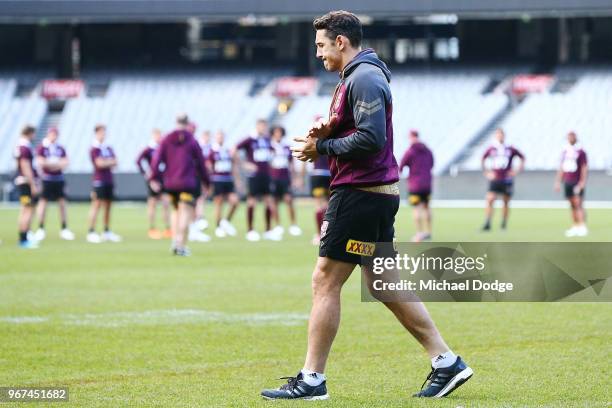 Billy Slater, out with a hamstring injury, walks alone during a Queensland Maroons Captain's Run at the Melbourne Cricket Ground on June 5, 2018 in...