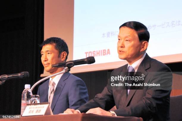 Toshiba Memory President Yasuo Naruke and Bain Capital Japan chief Yuji Sugimoto attend a press conference on June 4, 2018 in Tokyo, Japan.