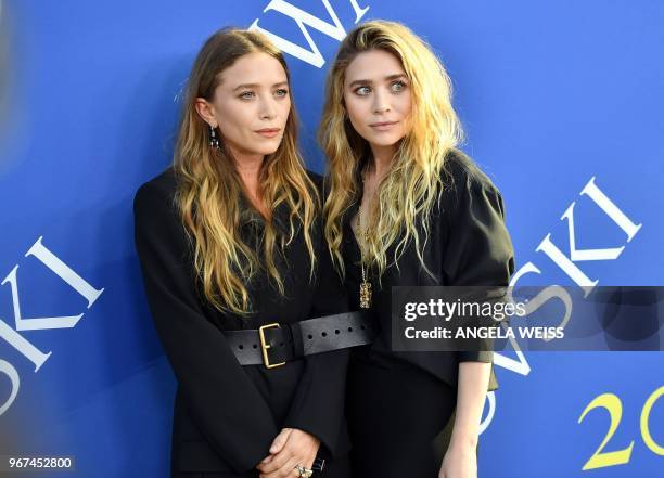 Fashion designer Mary-Kate Olsen and Ashley Olsen arrives at the 2018 CFDA Fashion awards June 4, 2018 at The Brooklyn Museum in New York.