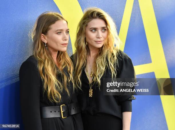 Fashion designer Mary-Kate Olsen and Ashley Olsen arrives at the 2018 CFDA Fashion awards June 4, 2018 at The Brooklyn Museum in New York.