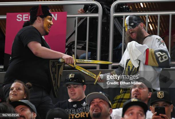 Vegas Golden Knights fans joke around during a Golden Knights road game watch party for Game Four of the 2018 NHL Stanley Cup Final between the...