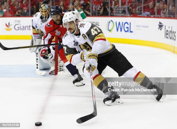 Luca Sbisa of the Vegas Golden Knights is chased by Devante Smith-Pelly of the Washington Capitals during the first period of Game Four of the 2018...