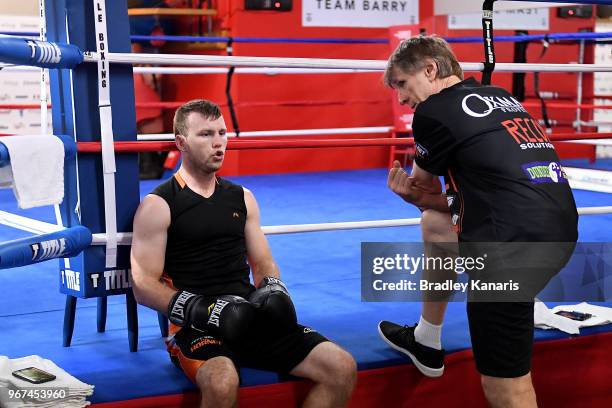 Trainer Glenn Rushton talks tactics with Jeff Horn during a training session on June 4, 2018 in Las Vegas, Nevada.