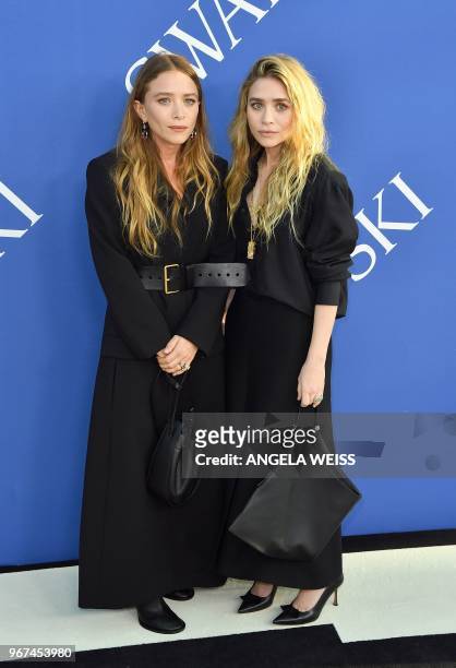 Fashion designer Mary-Kate Olsen and Ashley Olsen arrives at the 2018 CFDA Fashion awards June 4, 2018 at The Brooklyn Museum in New York.