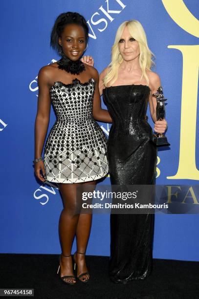 Lupita Nyong'o and the 2018 CFDA International award winner Donatella Versace attend the 2018 CFDA Fashion Awards Winners Walk at Brooklyn Museum on...