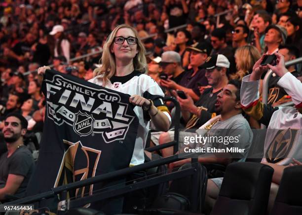Vegas Golden Knights fan Sarah Klopp holds a Golden Knights Stanley Cup Final banner during a Golden Knights road game watch party for Game Four of...