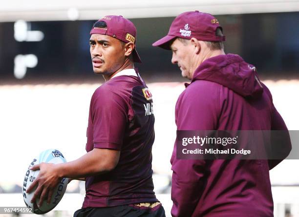 Anthony Milford of the Maroons walks out with Kevin Walters the coach during a Queensland Maroons Captain's Run at the Melbourne Cricket Ground on...