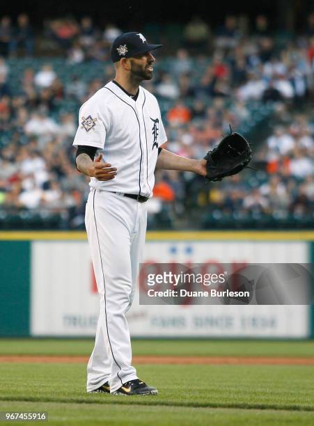 Starting pitcher Mike Fiers of the Detroit Tigers has an exchange with Giancarlo Stanton of the New York Yankees after Fiers hit Stanton with a pitch...