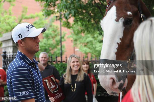 Defending PGA Champion, Justin Thomas greets a Clydesdale during the 2018 PGA Championship Media Day visit to Anheuser-Busch Brewery on June 4, 2018...