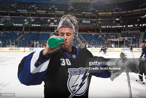 Goaltender Antero Niittymaki of the Tampa Bay Lightning gets a drink during pre-game skate against the Vancouver Canucks at the St. Pete Times Forum...