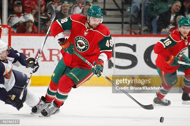 Guillaume Latendresse of the Minnesota Wild skates with the puck against the Atlanta Thrashers during the game at the Xcel Energy Center on February...