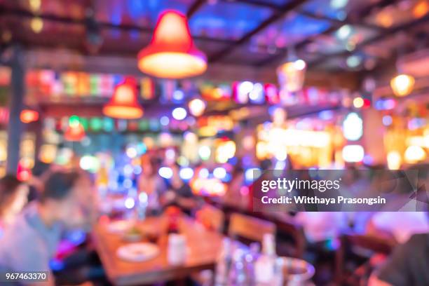 blurred background : customer at restaurant blur background with bokeh - blurred motion restaurant stock-fotos und bilder