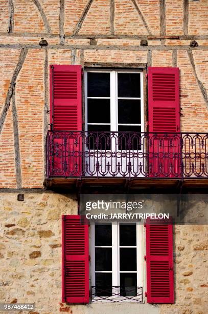 Facade of typical house located Place Edmond Michelet, Figeac, Lot, Midi-Pyrénées, France.