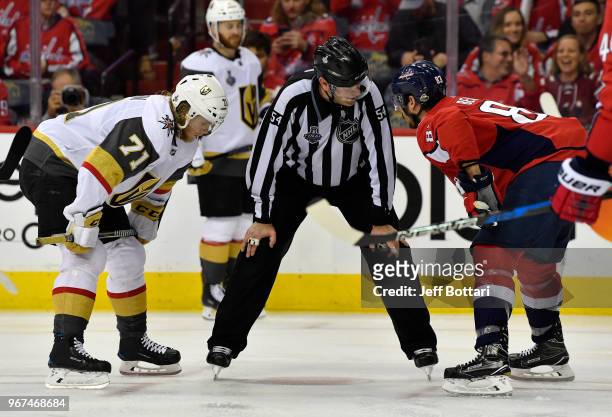 William Karlsson of the Vegas Golden Knights and Jay Beagle of the Washington Capitals line up for a face-off during the third period in Game Four of...