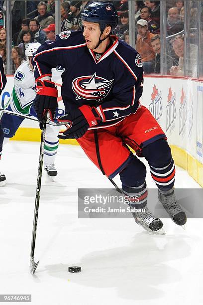 Defenseman Marc Methot of the Columbus Blue Jackets skates with the puck against the Vancouver Canucks on February 12, 2010 at Nationwide Arena in...