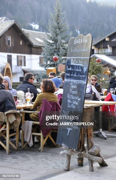 Terrace of Le Coup de Coeur wine bar and restaurant, Morzine ski resort, Portes du Soleil skiing area, region of Chablais, Haute-Savoie department,...