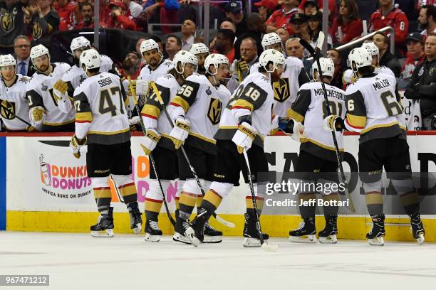 The Vegas Golden Knights celebrate after a goal by Reilly Smith during the third period against the Washington Capitals in Game Four of the Stanley...