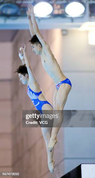 Si Yajie of China and Lian Junjie of China compete in the Mixed 10m Synchro Platform final on the opening day of the 21st FINA Diving World Cup 2018...