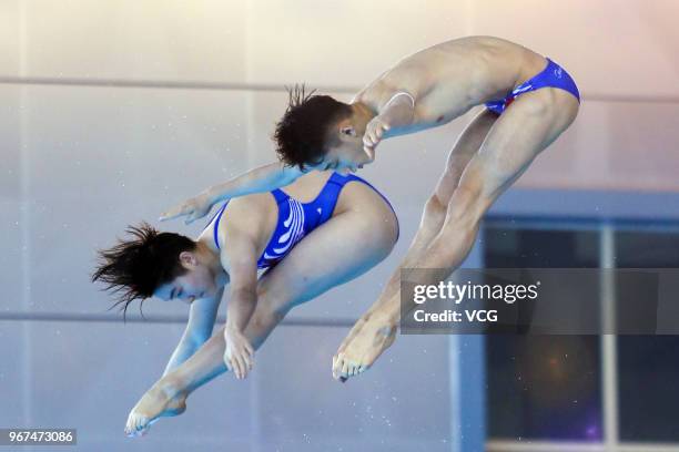 Si Yajie of China and Lian Junjie of China compete in the Mixed 10m Synchro Platform final on the opening day of the 21st FINA Diving World Cup 2018...