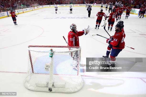 Braden Holtby and Brooks Orpik of theWashington Capitals celebrate their team's 6-2 win over the Vegas Golden Knights in Game Four of the 2018 NHL...