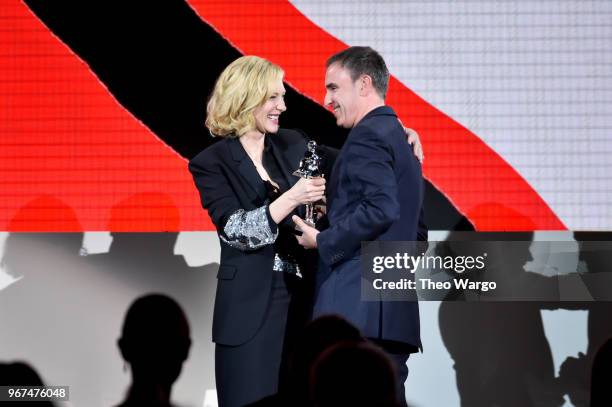 Cate Blanchett presents the 2018 CFDA Womenswear Designer of The Year award to Raf Simons during the 2018 CFDA Fashion Awards Winners Walk at...