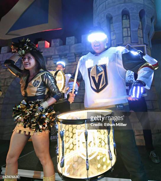 Member of the Vegas Golden Knights Golden Aces cheers as members of the Vegas Golden Knights Knight Line Drumbots perform in the Castle during a...