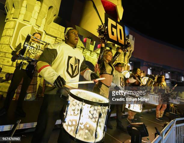 Members of the Vegas Golden Knights Knight Line Drumbots and the Vegas Golden Knights Golden Aces perform in the Castle during a Golden Knights road...