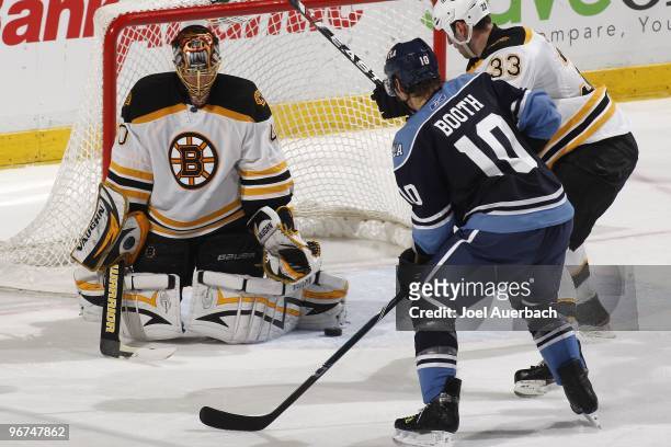Goaltender Tuukka Rask of the Boston Bruins stops a shot by David Booth of the Florida Panthers on February 13, 2010 at the BankAtlantic Center in...