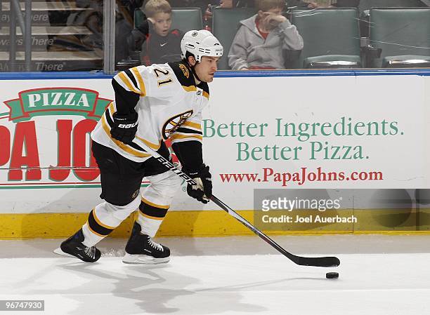 Andrew Ference of the Boston Bruins carries the puck into the Florida Panthers end on February 13, 2010 at the BankAtlantic Center in Sunrise,...