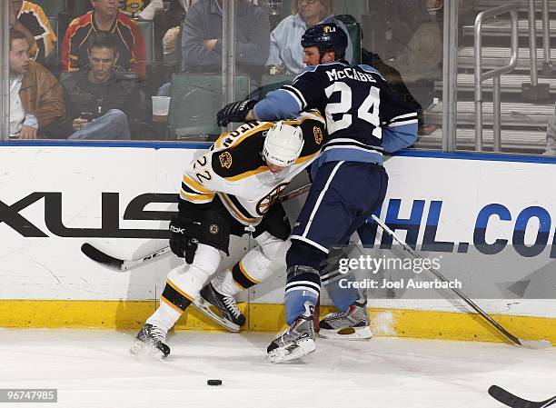 Shawn Thornton of the Boston Bruins is checked by Bryan McCabe of the Florida Panthers on February 13, 2010 at the BankAtlantic Center in Sunrise,...