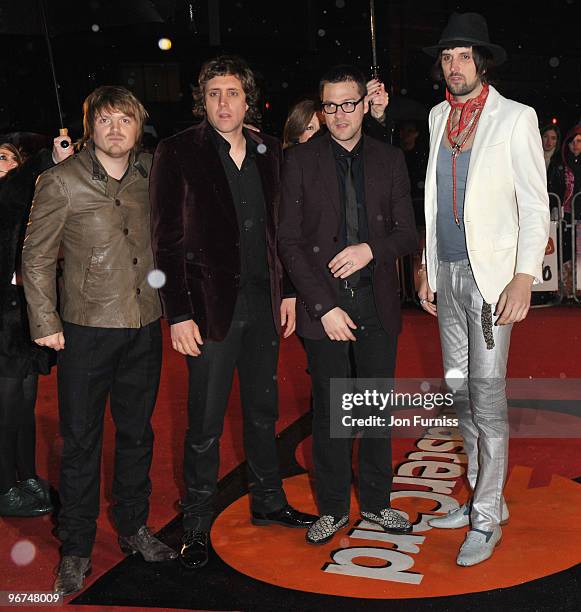 Chris Edwards, Ian Matthews, Tom Meighan and Serio Pizzorno of Kasabian arrive on the red carpet for The Brit Awards 2010 at Earls Court on February...