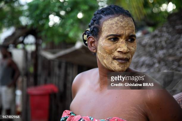 Malagasy woman with face painting on the village of Ambatoloaka, Nosy Be on December 20, 2010 in Ambatoloaka, Madagascar.