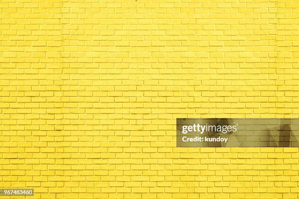 yellow bricks pattern on wall for abstract background. - brick pattern stock-fotos und bilder