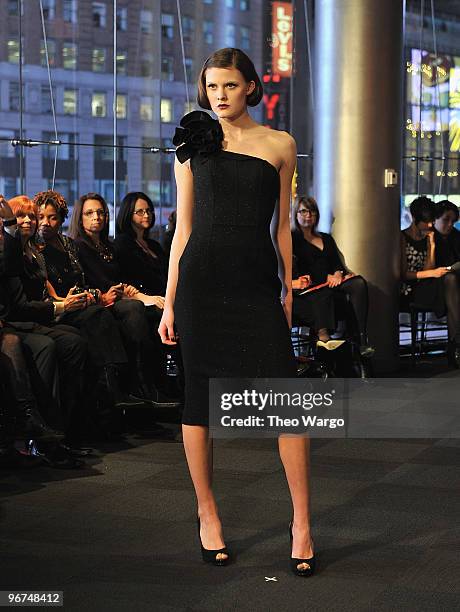 Models walk during Carmen Marc Valvo Fall 2010 at NASDAQ on February 15, 2010 in New York City.