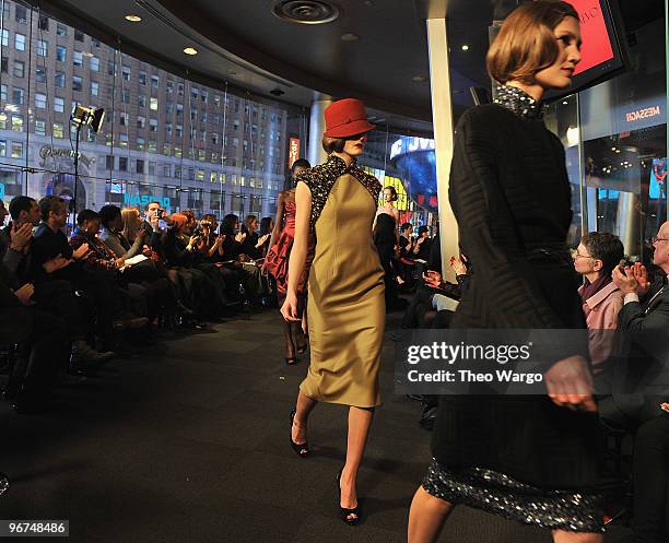 Models walk during Carmen Marc Valvo Fall 2010 at NASDAQ on February 15, 2010 in New York City.