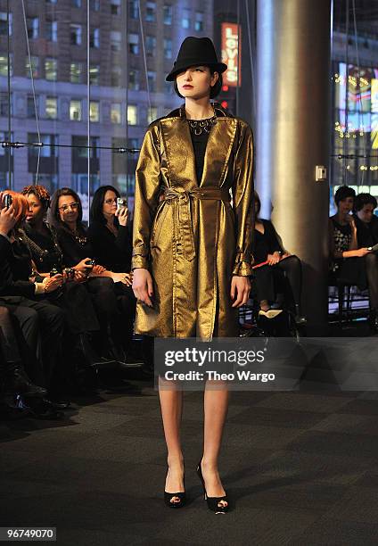 Models walk during Carmen Marc Valvo Fall 2010 at NASDAQ on February 15, 2010 in New York City.