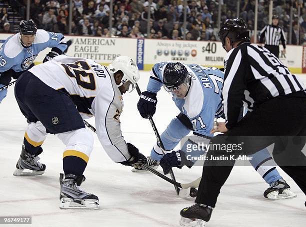 Evgeni Malkin of the Pittsburgh Penguins and Joel Ward of the Nashville Predators battle for the face-off at Mellon Arena on February 14, 2010 in...