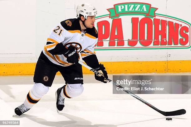 Andrew Ference of the Boston Bruins skates with the puck against the Florida Panthers at the BankAtlantic Center on February 13, 2010 in Sunrise,...