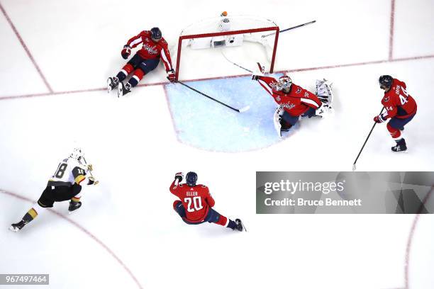 Braden Holtby of the Washington Capitals grabs the puck after it hit the post against James Neal of the Vegas Golden Knights during the first period...