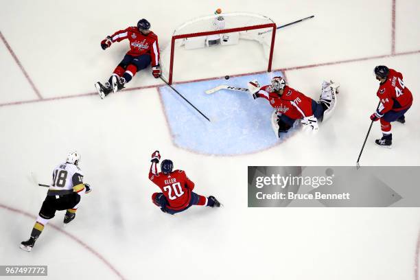 Braden Holtby of the Washington Capitals grabs the puck after it hit the post against James Neal of the Vegas Golden Knights during the first period...