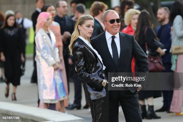 Amber Heard and Michael Kors arrive for the 2018 CFDA Fashion Awards at Brooklyn Museum on June 4, 2018 in New York City.