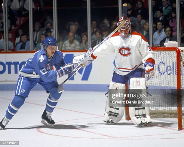 Mats Sundin of the Quebec Nordiques skates against Patrick Roy of the Montreal Canadiens in the early 1990's at the Montreal Forum in Montreal,...