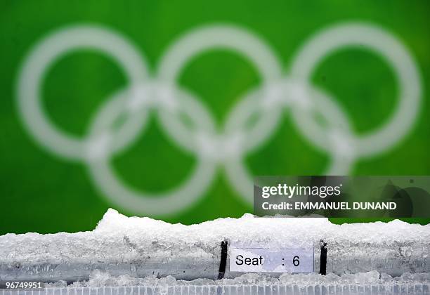 The Olympic logo is seen as rain showers replace snow flurries on February 16, 2010 at the Whistler Creekside Alpine skiing venue of the Vancouver...